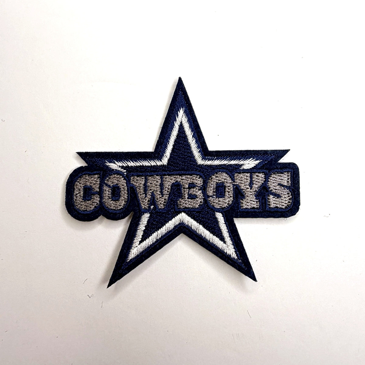 Navy star patch with white lettering