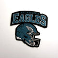 Teal football helmet patch with arch lettering
