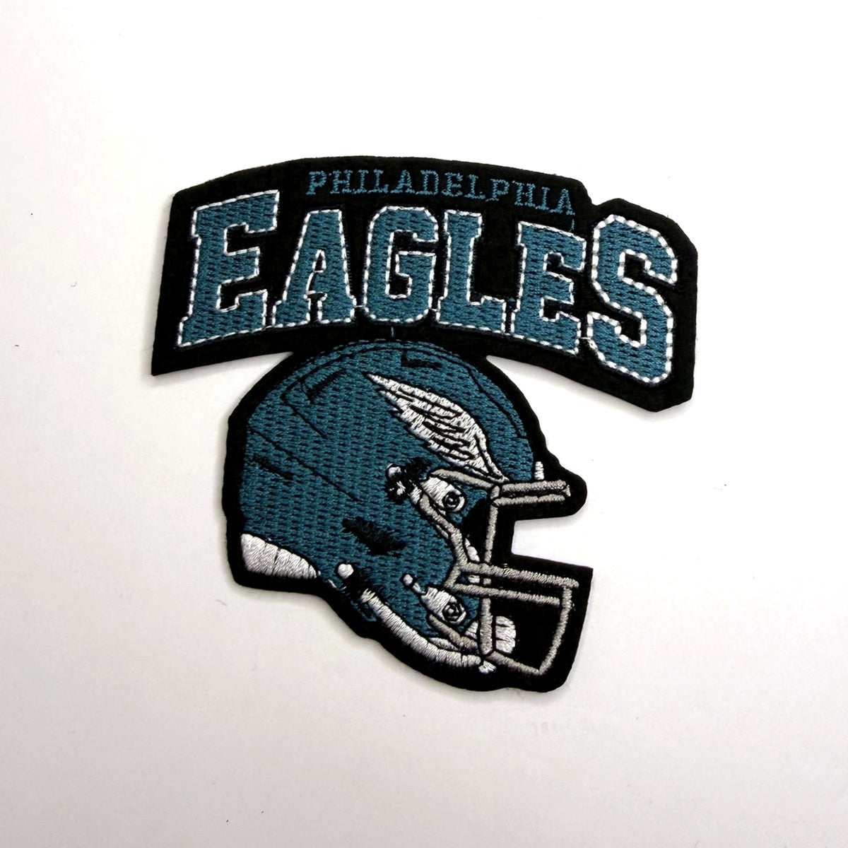 Teal football helmet patch with arch lettering