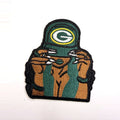Woman holding a green cap patch