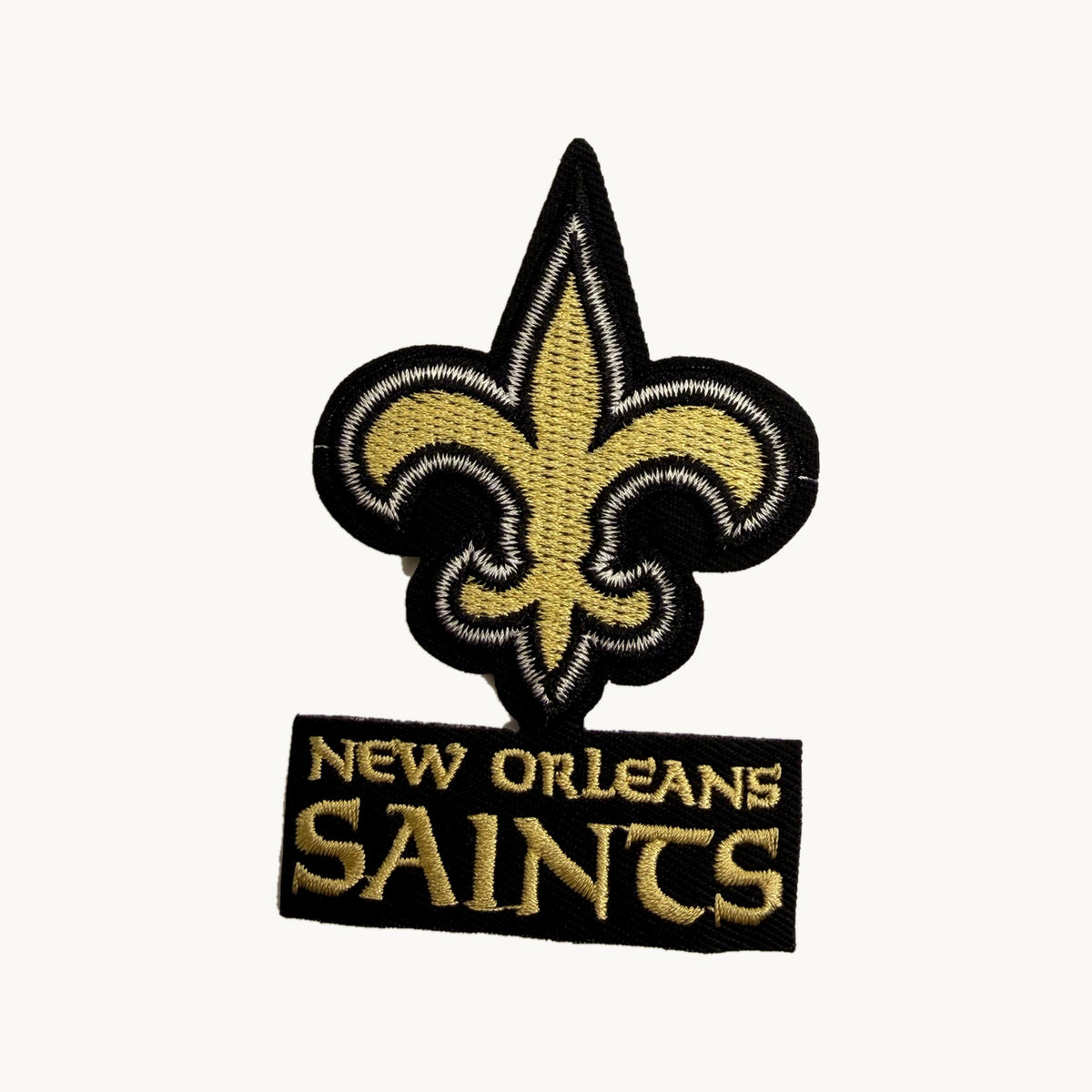 Gold fleur-de-lis with black lettering bar patch