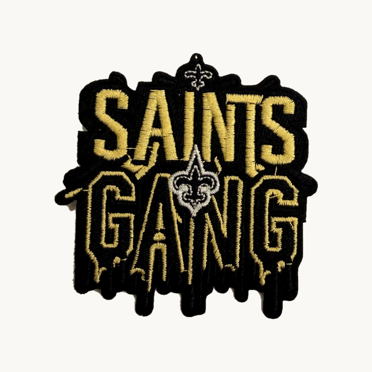 Black and gold dripping letters patch with fleur-de-lis
