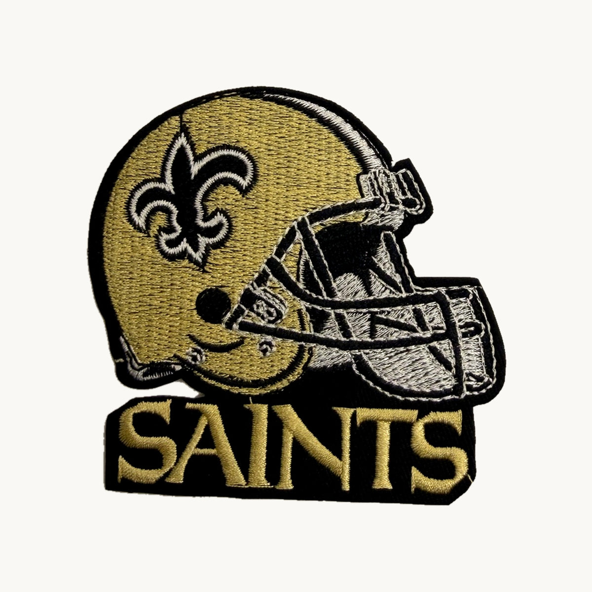 Gold football helmet patch with fleur-de-lis